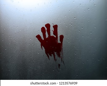 Scary Window Glass With Water Drops In A Dark Light And Red Blood Hand