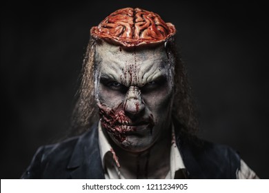 Scary zombie prostheric makeup on male model