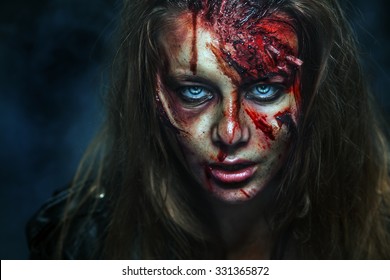 Scary zombie woman with wounds. 