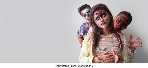 Scary zombies on grey background with space for text - Shutterstock ID 2202036845