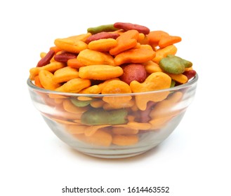 A Scaterring Of Colorful Goldfish Crackers In Glass Bowl On White