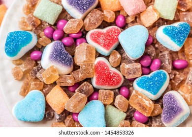 Scattered candy and sugar sweets in the shape of heart, cute tasty jelly beans - Shutterstock ID 1454853326