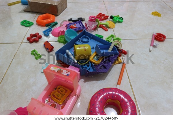 scattered children\'s toys at\
home