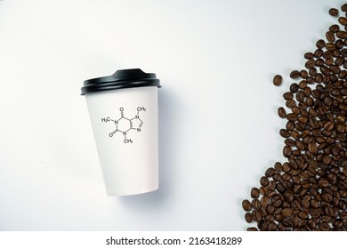 Scattered coffee beans isolated on white background. Caffeine formula structure. Caffeine stimulates the brain leading to creative ideas and success.