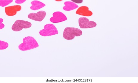 scattered colorful hearts confetti on white background - Powered by Shutterstock