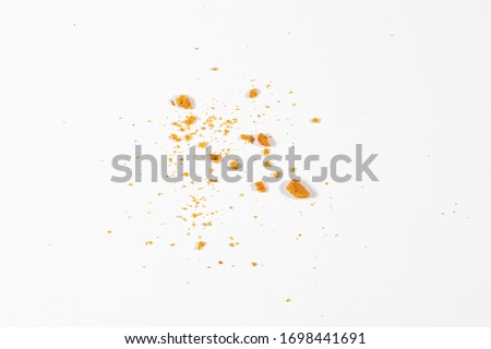 Scattered crumbs isolated on white background