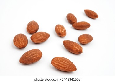 Scattered of delicious almond nuts isolated on white background