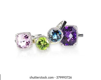 Scattered Gemstone And Diamond Halo Fine Jewelry Rings In A Grouping