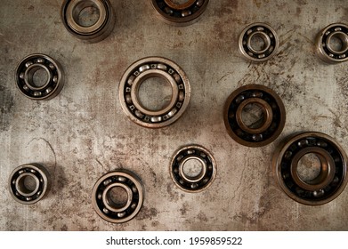 Scattered Metal Bearings Top View. Metal Trinkets In A Workshop. Top View In The Workshop