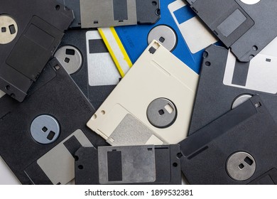 Scattered Old Floppy Disks Close-up, Top View. 1980s And 1990s Computer Technology.