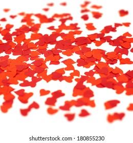 Scattered Over The White Background Heart Shaped Red Confetti, Shallow Depth Of Field