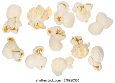 Scattered popcorn isolated on white. Close up shot.