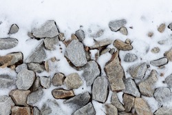 Scattered Rocks Covered In Snow