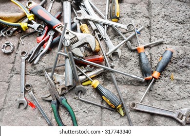 scattered-spanners-screwdrivers-on-ground-260nw-317743340.jpg