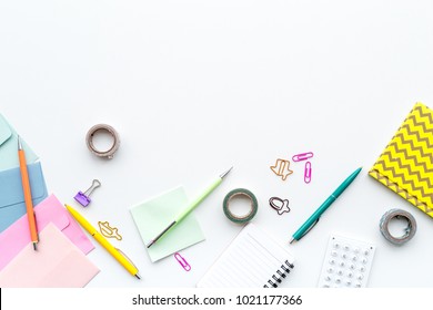 Scattered Stationery On Student's Desk. White Background Top View Copy Space