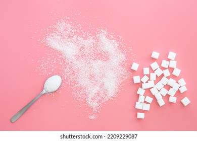 Scattered sugar and sugar cubes on a pink background, flat lay. - Shutterstock ID 2209229087