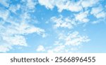 Scattered white clouds in a clear blue sky. Sky and cloud landscape. Sky background photo.