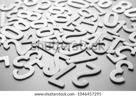 Scattered wood numbers on the table for mathematics concept