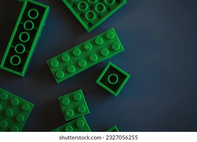 A scattering of constructor elements for children. Colored bricks from puzzle.