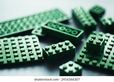 A scattering of constructor elements for children. Colored bricks from puzzle.