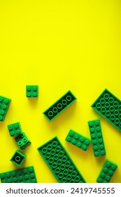 A scattering of constructor elements for children. Colored bricks from puzzle.