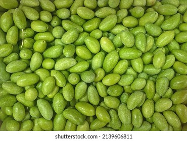 A scattering of fresh green olives - Shutterstock ID 2139606811
