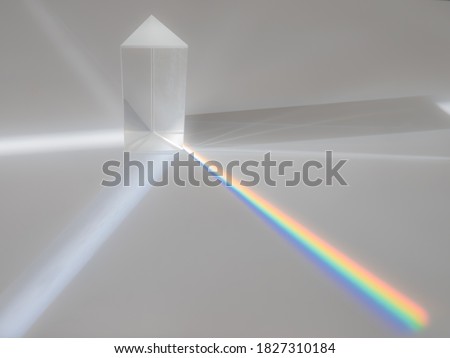Scattering of a ray of sunlight (white light) through a prism creating refraction, reflection and decomposition of light in the colors of the rainbow
