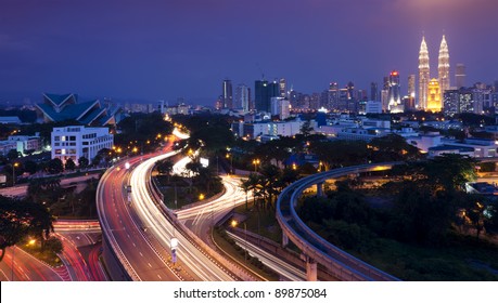 The Scenario Of Kuala Lumpur City, Taken With Slow Shutter Speed To Get The Light Trail From The Highway Traffic. Stunning Light Trail At Highway In Kuala Lumpur City