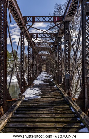 A scene of an abandoned Pratt through truss along the former Delaware and Hudson Railroad in Harpursville, New York.