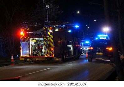 Scene Of An Accident On The Spalding Road At Night With Flashing Lights From Emergency Vehicles And Car Driving By. Boston Lincolnshire UK. Jan 2021