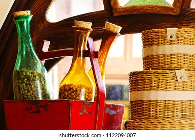 A Scene with Bottles and Baskets infront of a window.