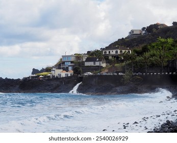 The scene captures distant misty cliffs merging smoothly with the vast ocean, enveloped in an atmosphere of serene and mysterious natural beauty - Madeira, Portugal.