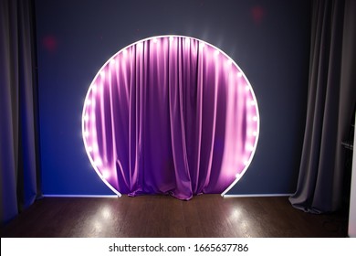 Scene With Circular Light Bulbs. Podium With Purple Backstage And Light