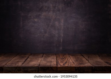 Scene creator. Mockup. Empty wooden deck table with dark concrete wall background.