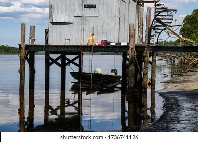 Scene Of A Dilapidated Boathouse And Old Fishing Skiff Along The Mattaponi River In Virginia USA