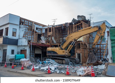 Scene of dismantling a house with heavy machinery.Hokkaido,Japan - Shutterstock ID 1589079649