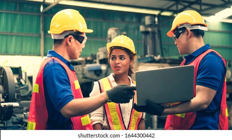 Scene of inspectors team asking information with woman worker and checking the safety and review the function in a factory, concept auditor safety, quality control in a factory, quality inspection.