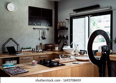 Scene Of Kitchen In Bakery Store With Camera And Tripod Light.