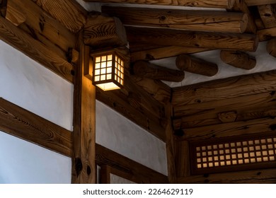A Scene of a Lamp Lit Under the Roof of an Old Traditional Hanok Wall in Seoul - Shutterstock ID 2264629119