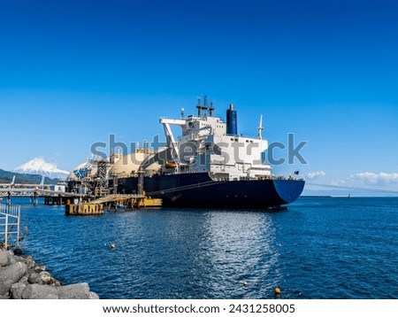 scene of LNG LNG tanker unloading using unloading arm at shimizu port in shizuoka japan.,

