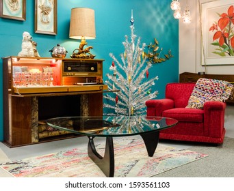 A scene of a Mid Century Modern living room decorated for the Christmas holiday season. 