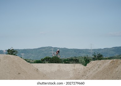 A scene of a motocross rider jumping beautifully during practice at the Sultan Agung circuit. : Bantul, Indonesia - 11 August 2021