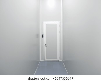 Scene of narrow corridor with finger scanner of entrance door room and passcode panel, modern door access control on white wall in industrial factory or warehouse. Fingerprint scan, security concept.