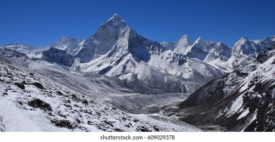 Scene on the way from Dzongla to Lobuche, Everest National Park. Mount Ama Dablam and other high mountains.