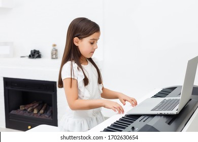 Scene of piano lessons online training or E-class learning while Coronavirus spread out or covid-19 crisis situation, vlog or teacher make online piano lesson to teach students pupils learn from home. - Powered by Shutterstock