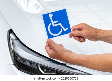 Scene of putting a wheelchair mark on a car - Shutterstock ID 2029830728