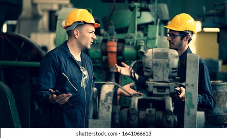 Scene Shot Of 2 Industrial Workers Feeling Upset With The Engine Machine Of The Factory, Arguing Planning, The Procedure Of Work In The Factory, Concept Industrial Worker Life, Working Confliction.