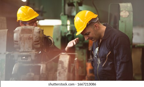 Scene Shot Of 2 Industrial Workers Feeling Upset With The Engine Machine Of The Factory, Arguing Planning, The Procedure Of Work In The Factory, Concept Industrial Worker Life, Working Confliction.