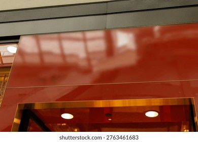 The scene shows an empty storefront ready for new signage. The facade is bright and clean, positioned in a busy shopping area with natural light streaming in.