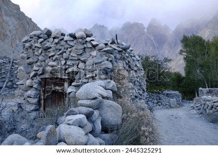 Scene of the small houses made with stones with stone walls at a small village in Passu Valley, Gilgit-Baltistan, Pakistan.